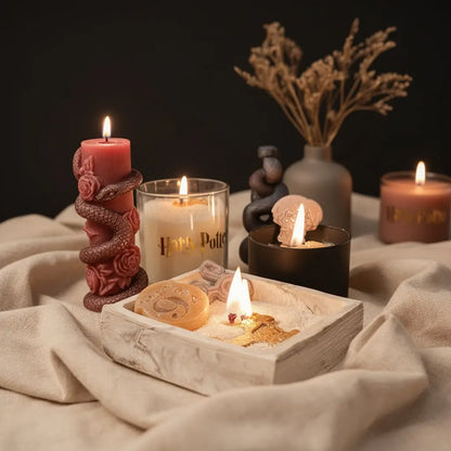 Complete Harry Potter candle set featuring concrete spellbook, black jar, glass jar, and snake sculpture