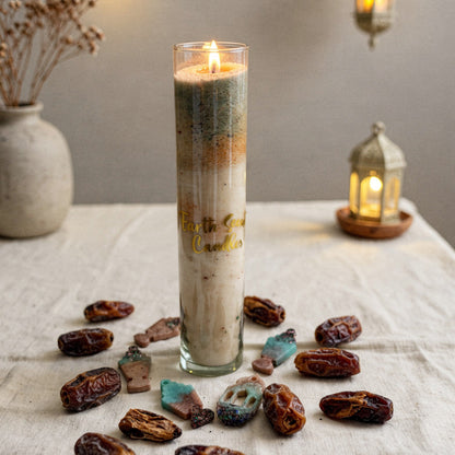 A tall glass container filled with our premium sand wax.