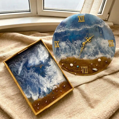 Handcrafted ocean resin watch tray with 3D blue waves and real seashells for jewelry display.